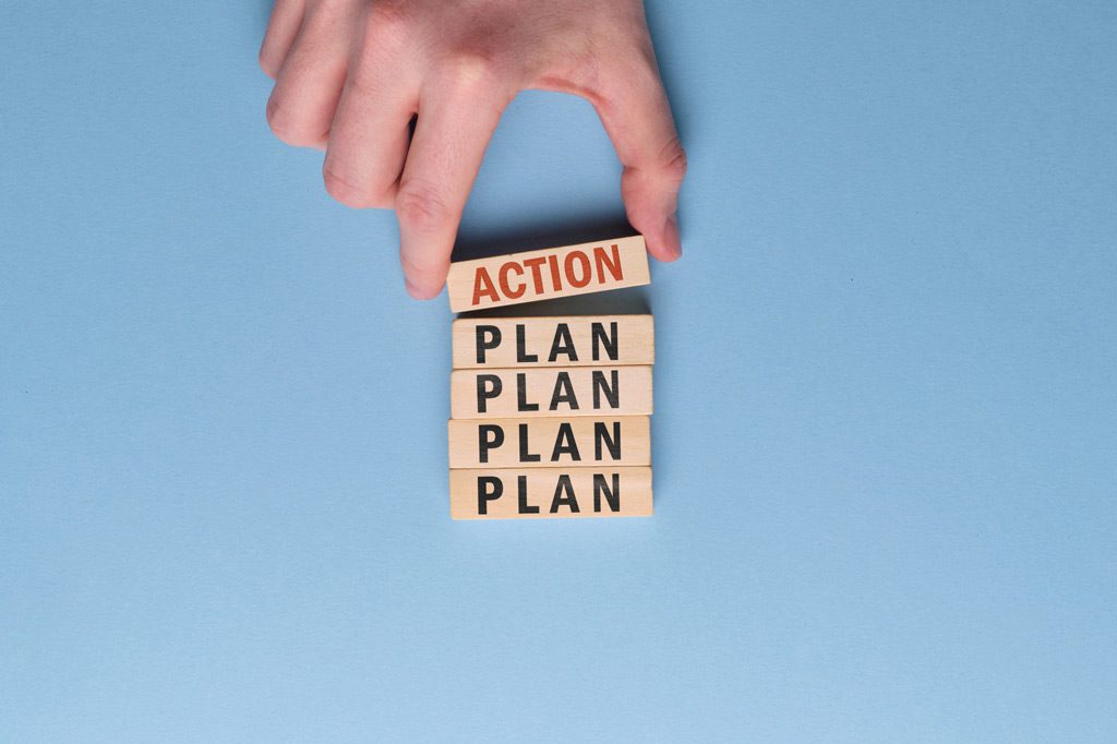 activation plan concept hand holds wooden block with inscription blue space