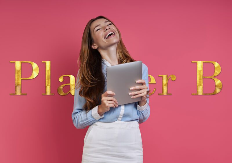 excited young woman holding digital tablet