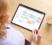 User interacting with a digital planner on iPad using Apple Calendar and stylus for scheduling