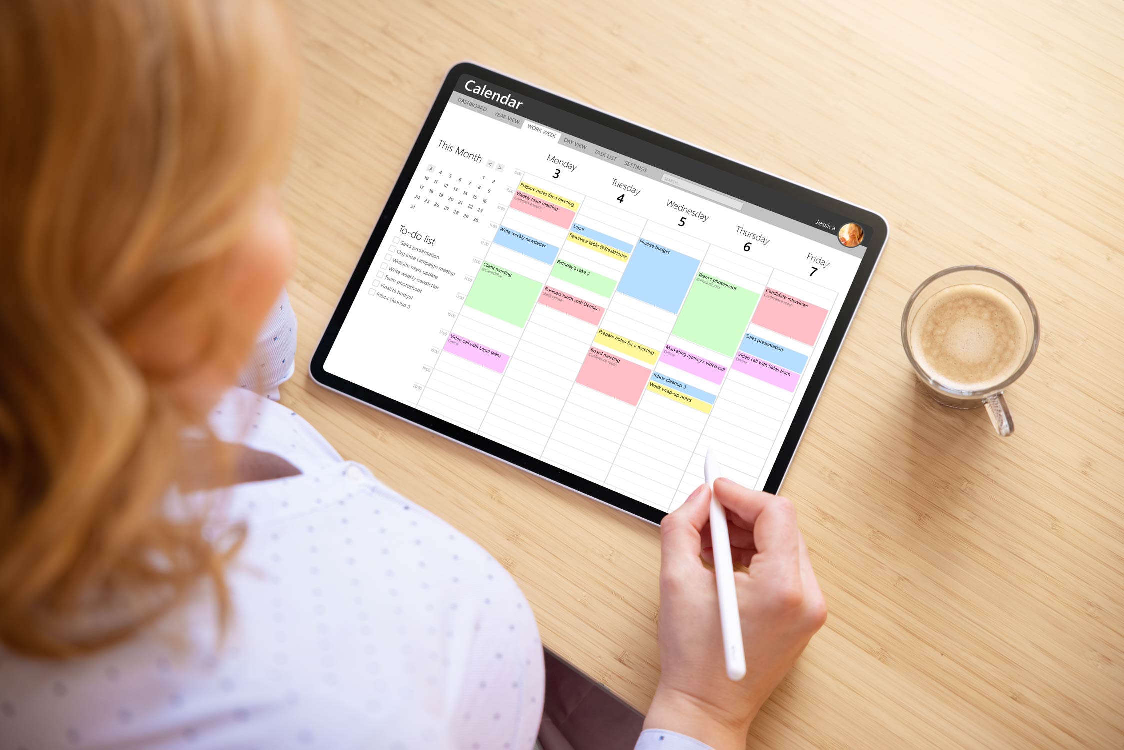User interacting with a digital planner on iPad using Apple Calendar and stylus for scheduling